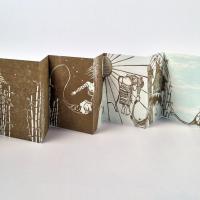 "Ninuno Espiritu" is an artist's book made of handmade paper printed withographs and woodcuts. The accordion book has no text, and illustrations spread from page to page. 