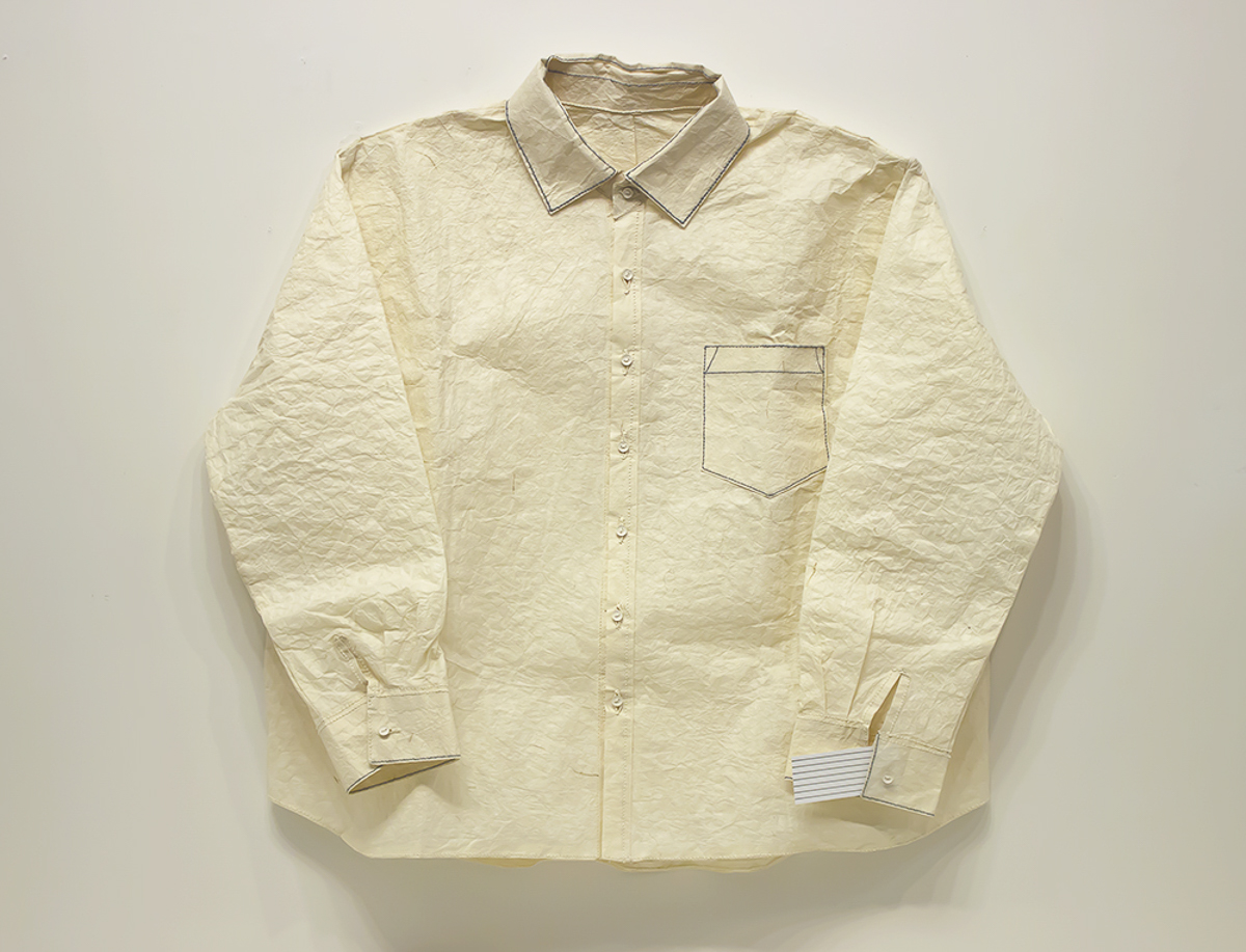 <strong>Shirt Books</strong> (A Blank Shirt Book)  |  Shoko Nakamura       <br />University of Iowa Center for the Book  Handmade paper, binding thread, handsewn technique   "A Blank Shirt Book" literally used binding thread to hand sew a sheet of paper into a life- size, button-up, long-sleeve shirt, complete with collar, cuffs, breast pocket, and hemmed edges. 