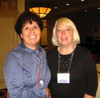 This picture shows Ellen G. K. Rubin on the left and Ann Montanaro on the right smiling at the camera. They are two founding members of The Movable Book Society.