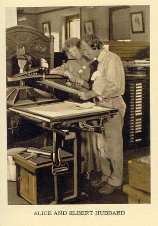 Black and White Photo of Alice and Elbert Hubbard in the letterpress shop on the Roycrofter Campus