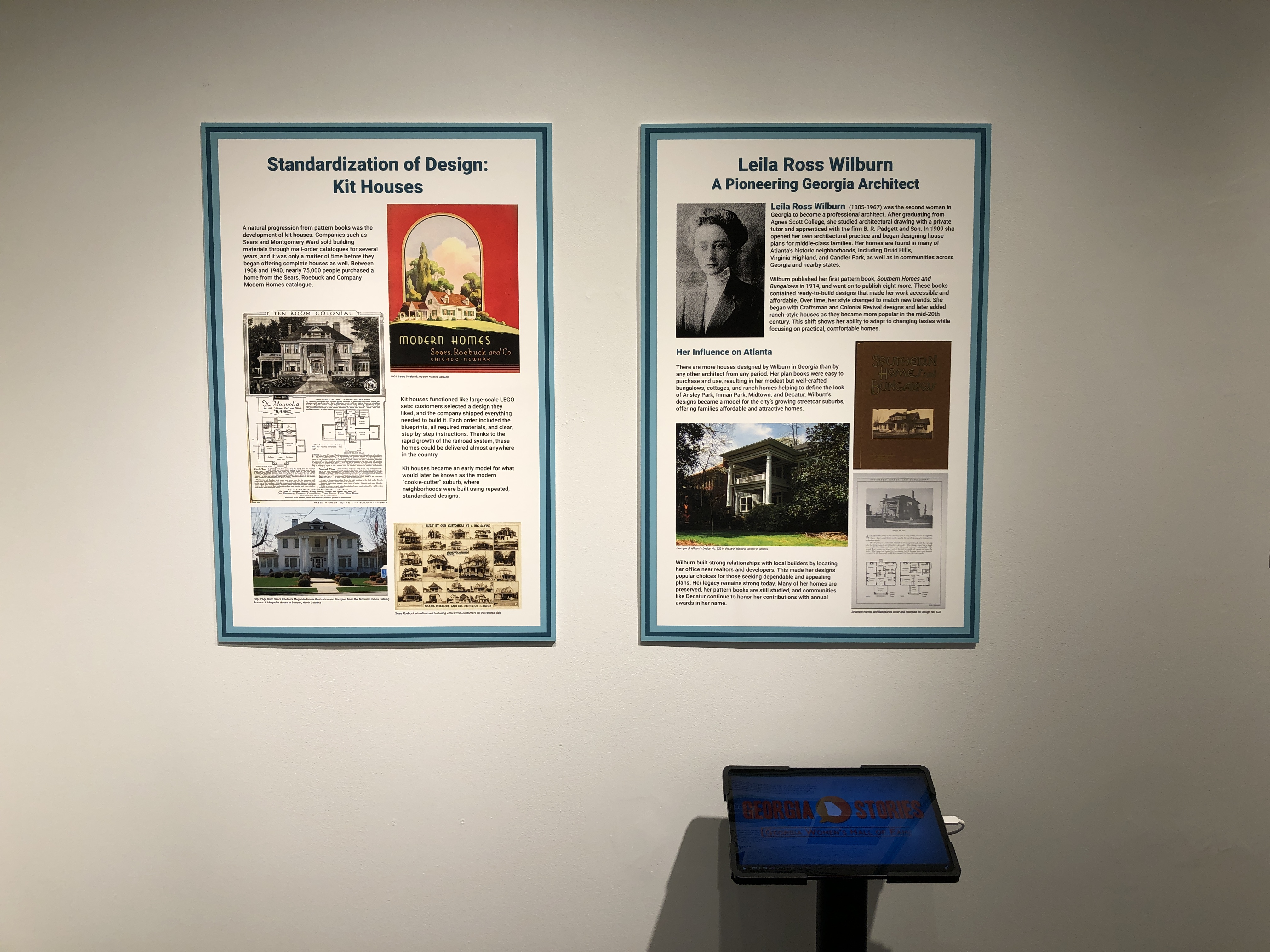 A view of two exhibition boards and a tablet. 