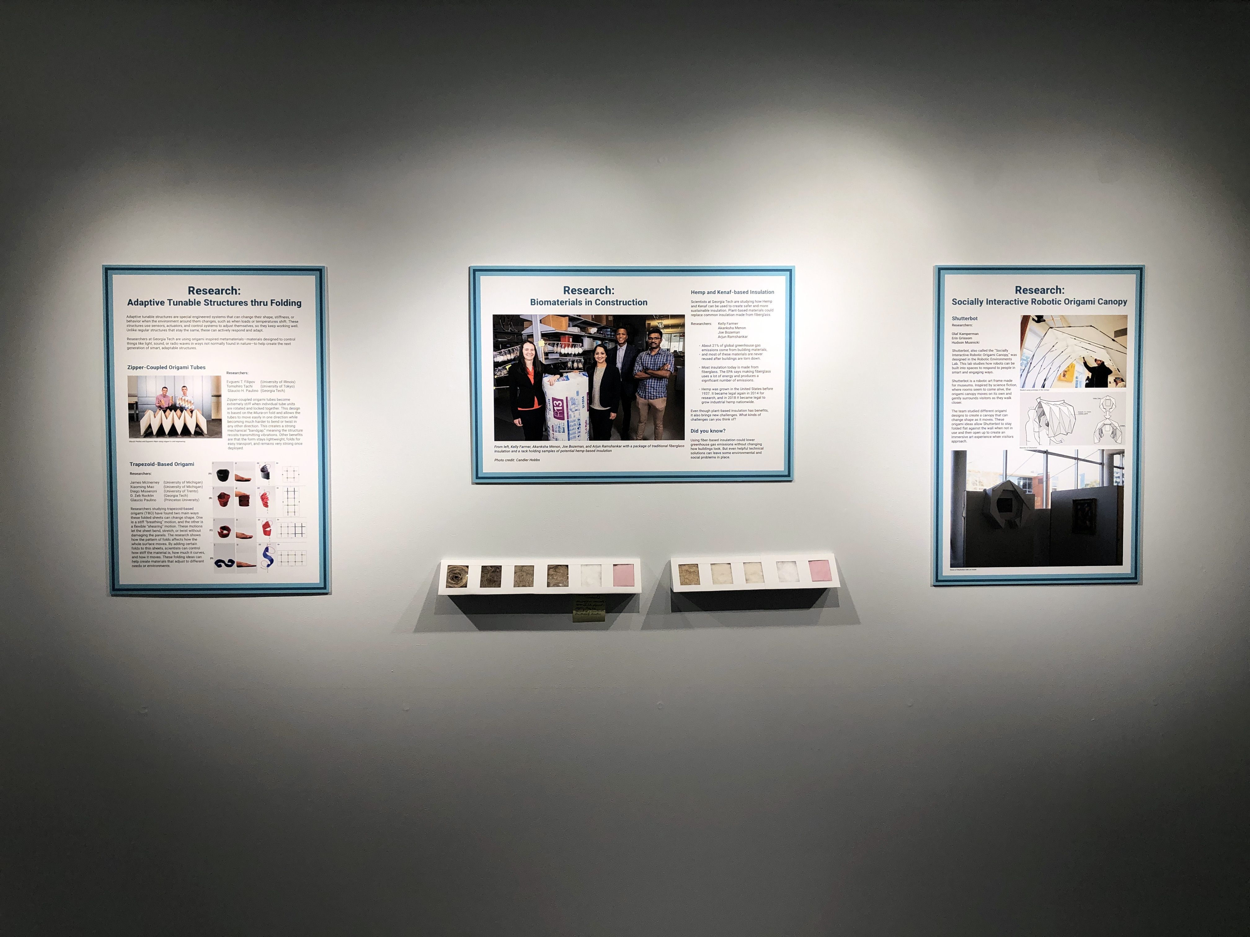 View of three exhibition boards and a tactile fiber installation.