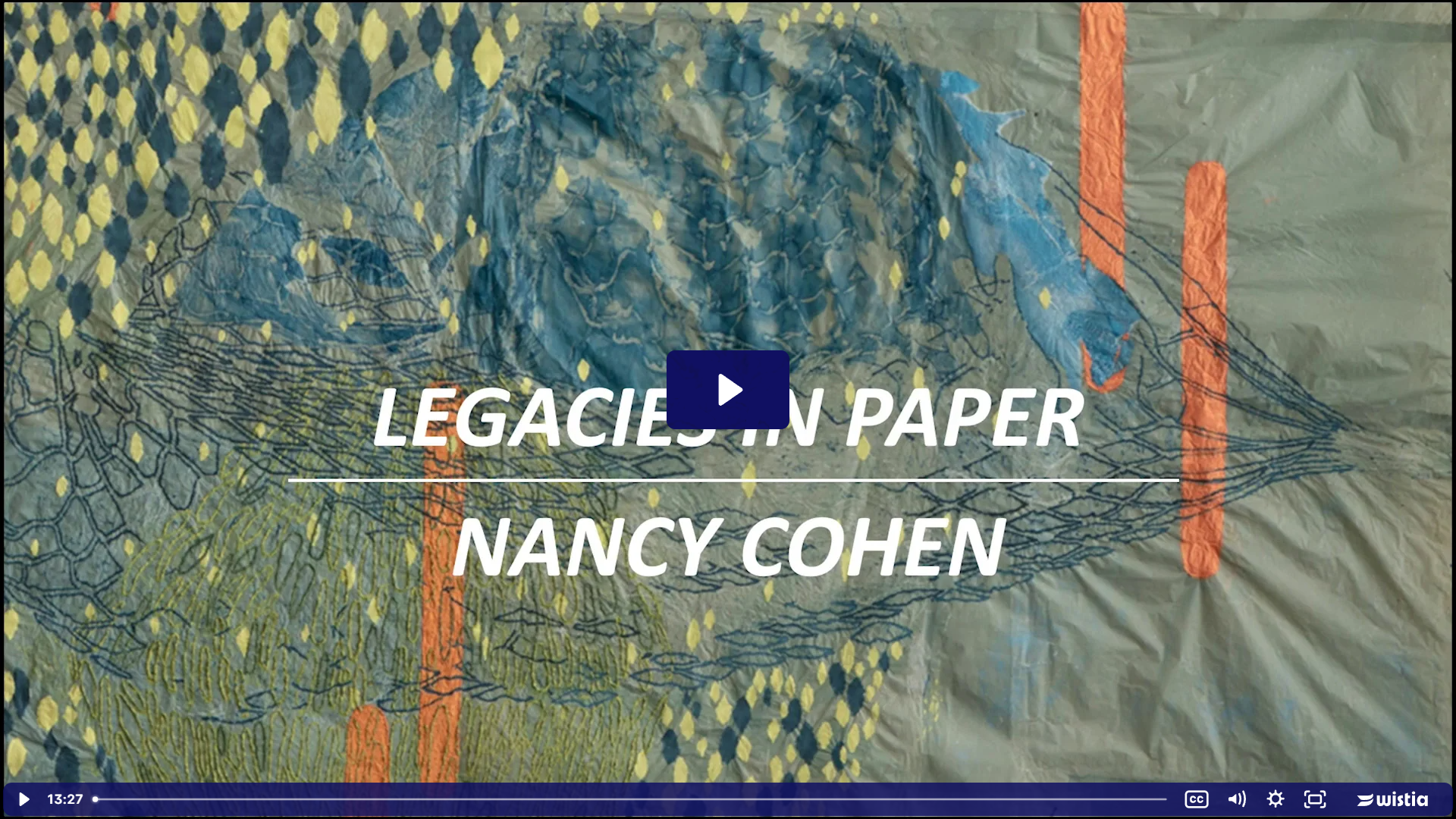 Close up of Nancy Cohen's Coming Through which features yellow, blue, and orange pulp painting on a olive green sheet. The yellow and blue create a diamond pattern in the upper left corner with a blue cloud like shape at the center and accents of bright orange vertical rectangles moving down the page in staggered pairs.
