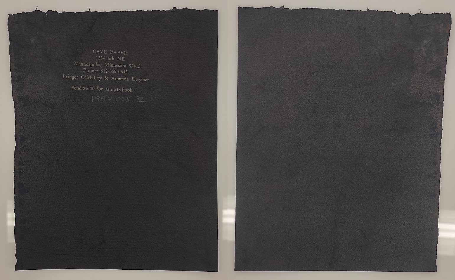 Deep black-purple irredescent paper, roughly textured, organically shapen rectangle, front and back.
