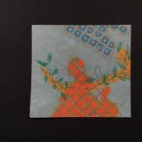 A light blue square of paper made from beaten bleached flax with green, blue, and orange floral patterns drawn across in paint pen over top of pigment blooming. 