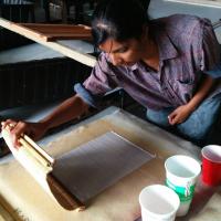 Photo of Radha Pandey making paper