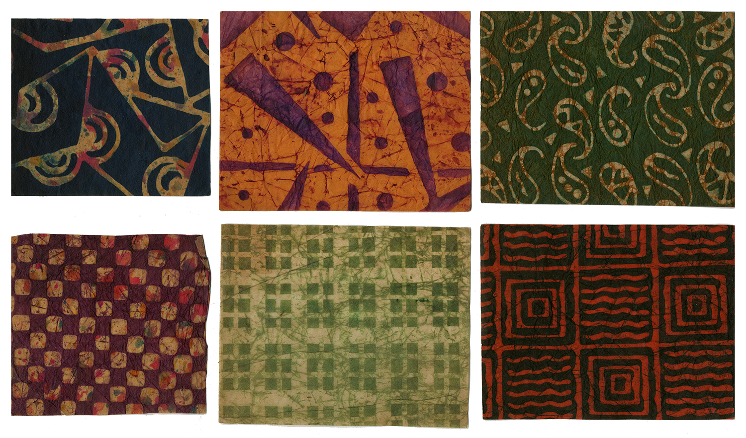 Six examples of batik paper - top row from left to right: black and yellow geometric pattern, yellow and purple geometric pattern, green and yellow paisley pattern; bottom row: purple and yellow checkered pattern, green and white rectangle checked pattern, black and red lined pattern