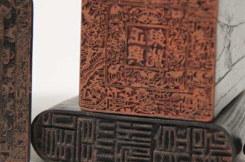An up close image of the design on two Chinese print seals