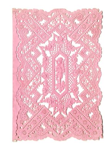 Pink card featuring a cupid in the center with lace cut outs