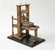 Wooden model of an early printing press