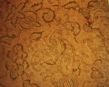 wall paper pattern: shimmering gray-green moths, vines, and gourds on a rust-colored background.