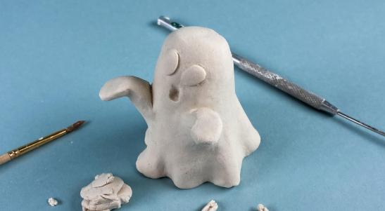 Ghost made from paper clay surrounded by tools