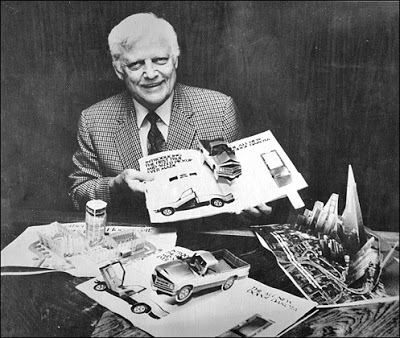 Black and white photo of Waldo Hunt in a suit and tie surrounded by some of the many pop-up books he published